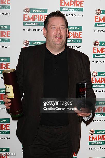 Johnny Vegas poses with the award for Best Actress collected on behalf of Zoe Saldana at the Winners Boards at the Jameson Empire Film Awards held at...