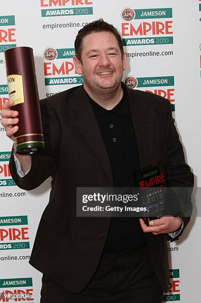 Johnny Vegas poses with the award for Best Actress collected on behalf of Zoe Saldana at the Winners Boards at the Jameson Empire Film Awards held at...