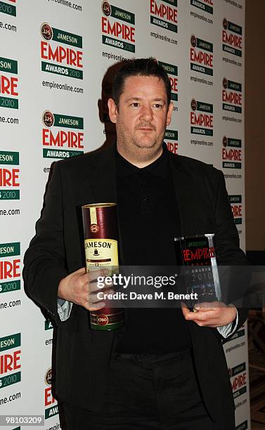 Johnny Vegas poses with Zoe Saldana's Best Actress Award during the Jameson Empire Film Awards at the Grosvenor House Hotel, on March 28, 2010 in...