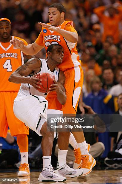 Raymar Morgan of the Michigan State Spartans looks to get past Brian Williams of the Tennessee Volunteers during the midwest regional final of the...