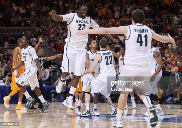 : : : Draymond Green, Garrick Sherman and the res of the Michigan State Spartans celebrate the win over Tennessee during the midwest regional final...