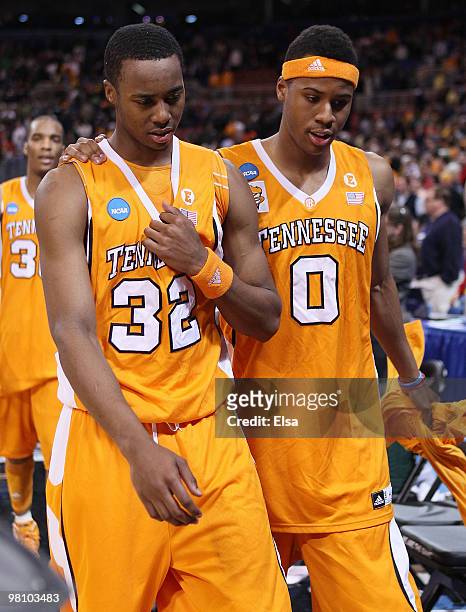 Scotty Hopson and Renaldo Woolridge of the Tennessee Volunteers walk off the court after the loss to the Michigan State Spartans during the midwest...