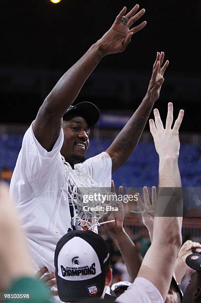 : : : : Kalin Lucas of the Michigan State Spartans is lifted by his teammates to cut the net during the midwest regional final of the 2010 NCAA men's...