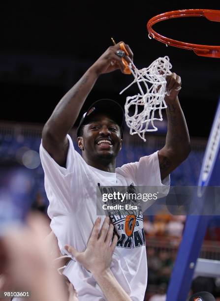 : : Kalin Lucas of the Michigan State Spartans is lifted by his teammates to cut the net during the midwest regional final of the 2010 NCAA men's...