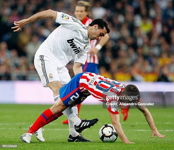 Alvaro Arbeloa of Real Madrid fights for a ball during the La Liga match between Real Madrid and Atletico de Madrid at Estadio Santiago Bernabeu on...