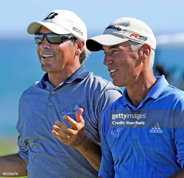 Fed Couples, left, and Corey Pavin, right, walk up the 18th fairway during the final round of The Cap Cana Championship on March 28, 2010 on the Jack...