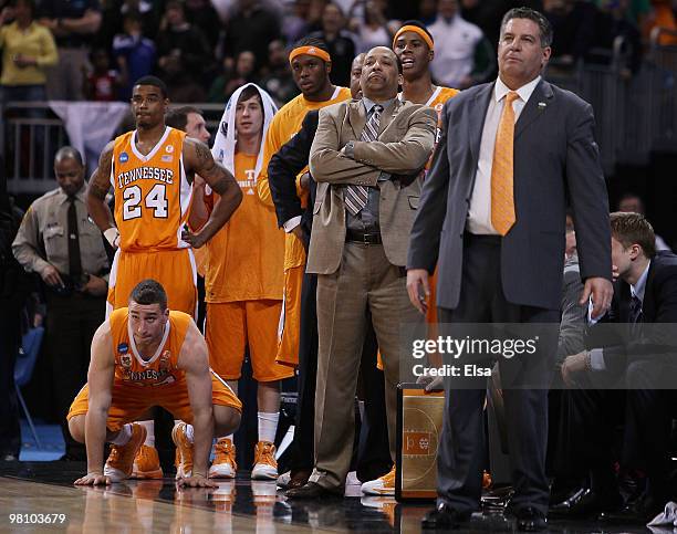 Head coach Bruce Pearl of the Tennessee Volunteers and the rest of his bench watch as the Michigan State Spartans shoot a free throw during the...