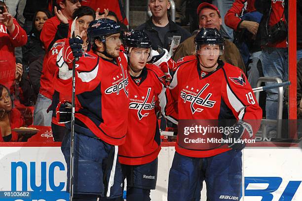 Alex Ovechkin, and Mike Green and Nicklas Backstrom of the Washington Capitals celebrate a goal during a NHL hockey game against the Calgary Flames...