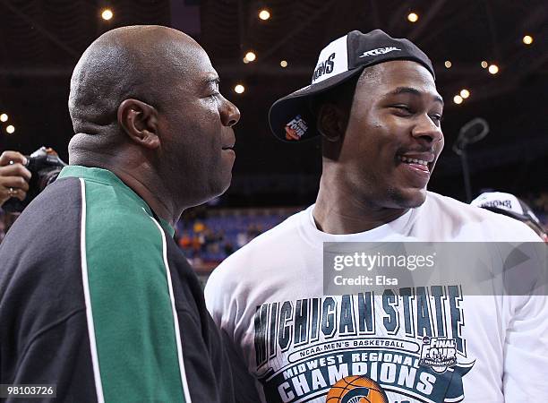 Magic Johnson congratulates Derrick Nix of the Michigan State Spartans after the game against the Tennessee Volunteers during the midwest regional...