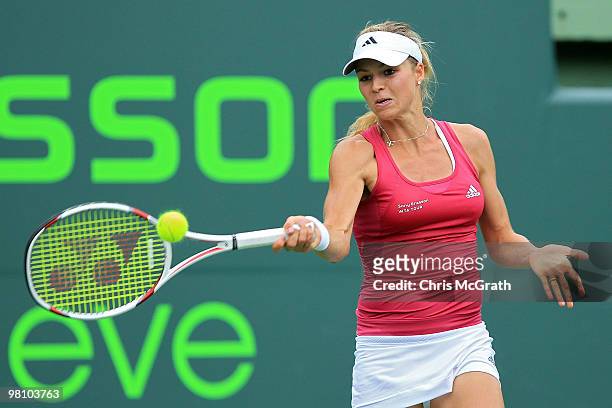 Maria Kirilenko of Russia returns a shot against Caroline Wozniacki of Denmark during day six of the 2010 Sony Ericsson Open at Crandon Park Tennis...