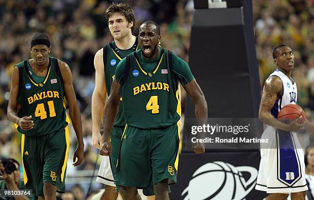 Forward Quincy Acy of the Baylor Bears reacts after making a slam dunk against the Duke Blue Devils during the south regional final of the 2010 NCAA...