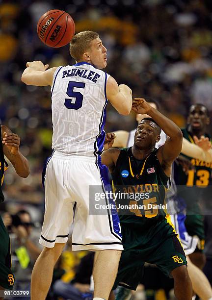 Mason Plumlee of the Duke Dlue Devils looses control of the ball under pressure from Tweety Carter of the Baylor Bears during the south regional...