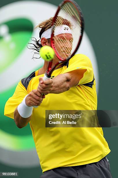 David Nalbandian of Argentina returns a shot against Rafael Nadal of Spain during day six of the 2010 Sony Ericsson Open at Crandon Park Tennis...