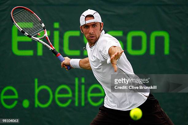 Benjamin Becker of Germany returns a shot against Tommy Robredo of Spain during day six of the 2010 Sony Ericsson Open at Crandon Park Tennis Center...