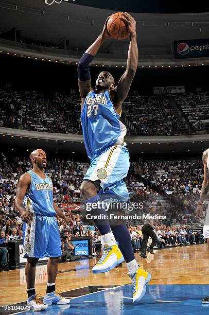 Johan Petro of the Denver Nuggets rebounds against the Orlando Magic during the game on March 28, 2010 at Amway Arena in Orlando, Florida. NOTE TO...