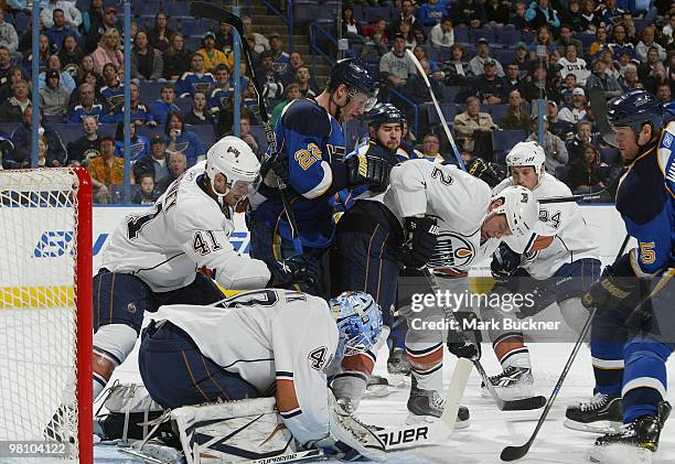 Devan Dubnyk, Taylor Chorney and Aaron Johnson of the Edmonton Oilers defend against Brad Boyes and Brad Winchester of the St. Louis Blues on March...