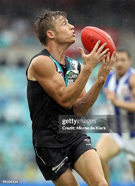 Jason Davenport of the Power catches the ball during the round one AFL match between the Port Adelaide Power and the North Melbourne Kangaroos at...