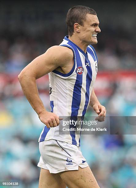 Scott Thompson of the Kangaroos comes off with knee injury during the round one AFL match between the Port Adelaide Power and the North Melbourne...