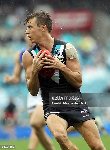Jason Davenport of the Power takes a catch during the round one AFL match between the Port Adelaide Power and the North Melbourne Kangaroos at AAMI...