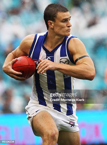 Scott Thompson of the Kangaroos runs the ball during the round one AFL match between the Port Adelaide Power and the North Melbourne Kangaroos at...