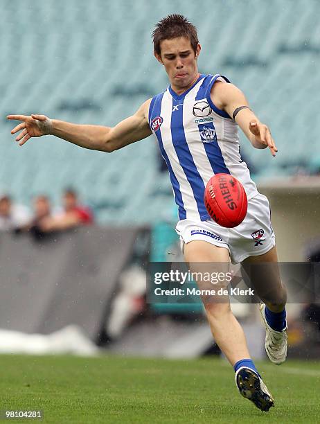 Ryan Bastinac of the Kangaroos kicks during the round one AFL match between the Port Adelaide Power and the North Melbourne Kangaroos at AAMI Stadium...