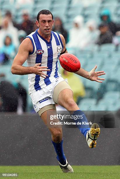 Todd Goldstein of the Kangaroos kicks during the round one AFL match between the Port Adelaide Power and the North Melbourne Kangaroos at AAMI...