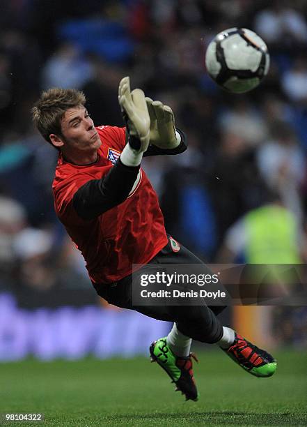 David de Gea of Atletico Madrid warms-up before the start of the La Liga match between Real Madrid and Atletico Madrid at Estadio Santiago Bernabeu...