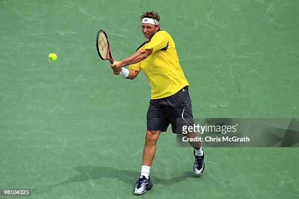 David Nalbandian of Argentina returns a shot against Rafael Nadal of Spain during day six of the 2010 Sony Ericsson Open at Crandon Park Tennis...