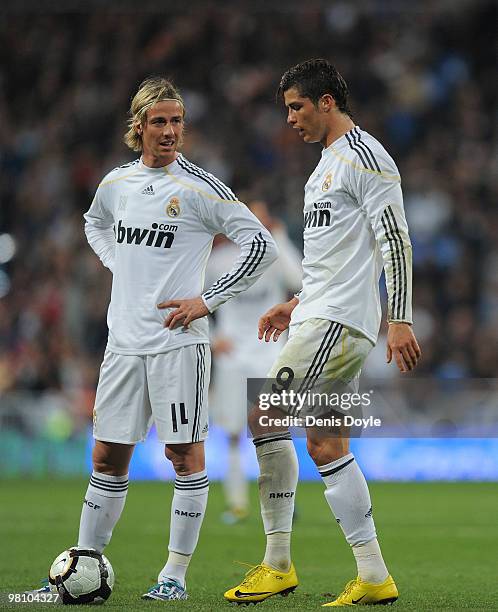 Cristiano Ronaldo of Real Madrid lines-up a free kick beside Guti during the La Liga match between Real Madrid and Atletico Madrid at Estadio...