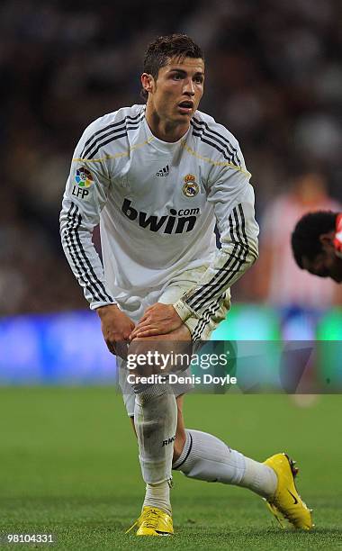 Cristiano Ronaldo of Real Madrid gets up after heading the ball during the La Liga match between Real Madrid and Atletico Madrid at Estadio Santiago...