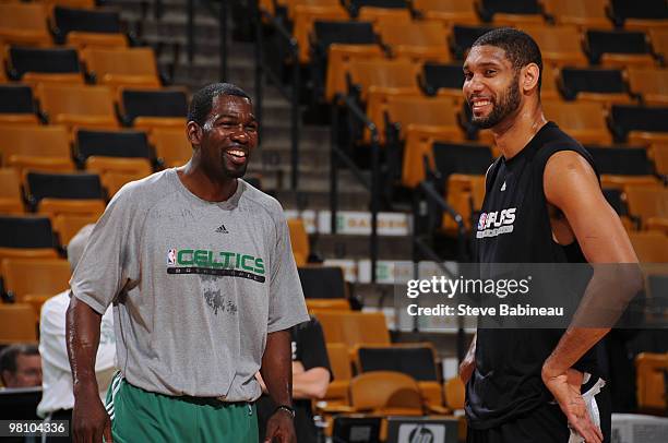 Michael Finley of the Boston Celtics chats with Tim Duncan of the San Antonio Spurs during warm-ups on March 28, 2010 at the TD Garden in Boston,...