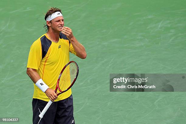 David Nalbandian of Argentina reacts against Rafael Nadal of Spain during day six of the 2010 Sony Ericsson Open at Crandon Park Tennis Center on...