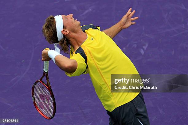 David Nalbandian of Argentina serves against Rafael Nadal of Spain during day six of the 2010 Sony Ericsson Open at Crandon Park Tennis Center on...