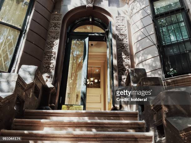brownstone classic doorway and steps in manhattan new york - front porch no people stock pictures, royalty-free photos & images