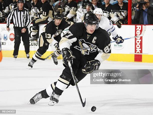 Sidney Crosby of the Pittsburgh Penguins moves the puck up ice against the Toronto Maple Leafs on March 28, 2010 at Mellon Arena in Pittsburgh,...