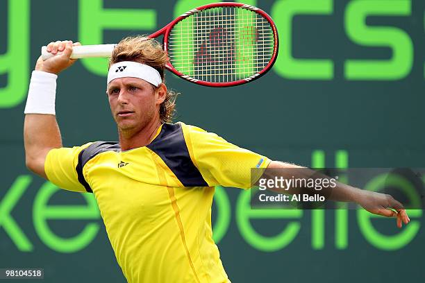 David Nalbandian of Argentina returns a shot against Rafael Nadal of Spain during day six of the 2010 Sony Ericsson Open at Crandon Park Tennis...