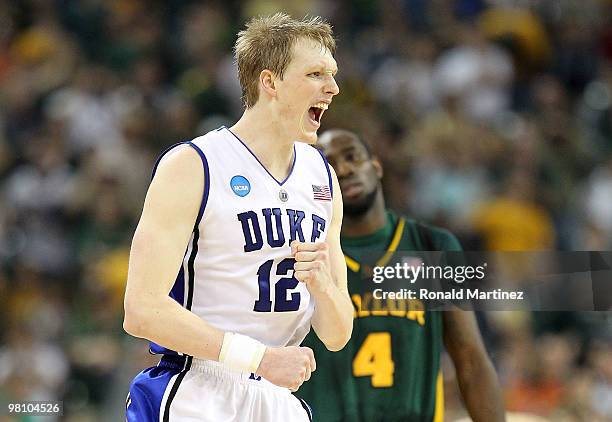 Forward Kyle Singler of the Duke Blue Devils reacts in a 78-71 win against the Baylor Bears during the south regional final of the 2010 NCAA men's...