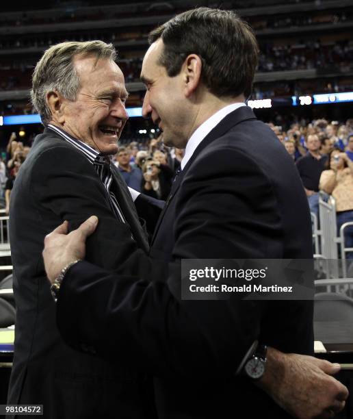 Former U.S. President George H.W. Bush congratulates Mike Krzyzewski of the Duke Blue Devils after a 78-71 win against the Baylor Bears during the...
