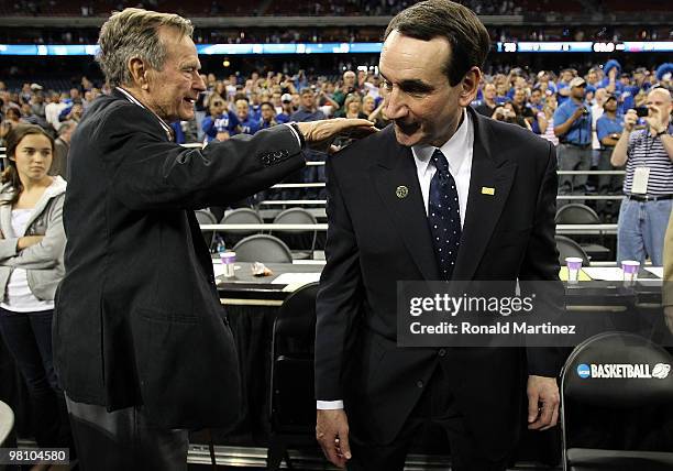 Former U.S. President George H.W. Bush congratulates Mike Krzyzewski of the Duke Blue Devils after a 78-71 win against the Baylor Bears during the...