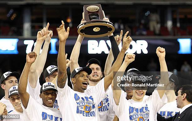 The Duke Blue Devils hold up the trophy after a 78-71 win against the Baylor Bears during the south regional final of the 2010 NCAA men's basketball...