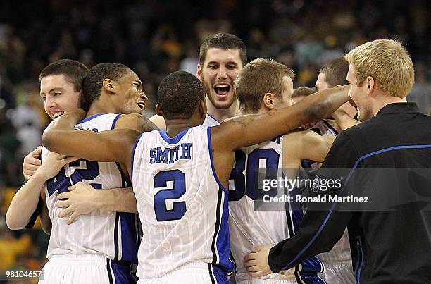 Ryan Kelly, Lance Thomas Nolan Smith, Brian Zoubek and Jon Scheyer of the Duke Blue Devils celebrate a win against the Baylor Bears during the south...