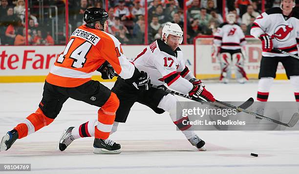 Ian Laperriere of the Philadelphia Flyers defends against the attack of Ilya Kovalchuk of the New Jersey Devils on March 28, 2010 at the Wachovia...