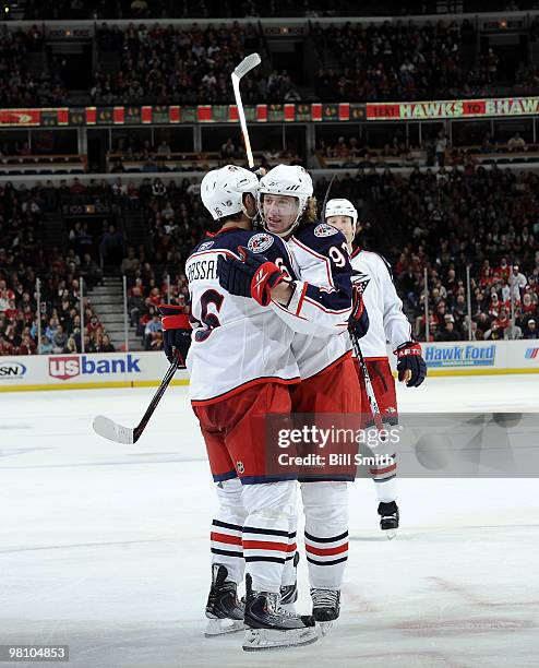 Jakub Voracek of the Columbus Blue Jackets hugs teammate Derick Brassard after scoring against the Chicago Blackhawks on March 28, 2010 at the United...