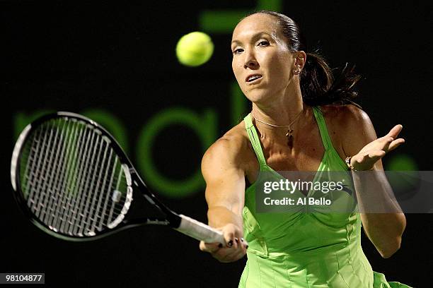 Jelena Jankovic of Serbia returns a shot against Elena Vesnina of Russia during day six of the 2010 Sony Ericsson Open at Crandon Park Tennis Center...