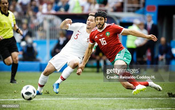 Raphael Gerreiro of Portugal and Nourredine Amrabat of Morroco battle for the ball during the 2018 FIFA World Cup Russia group B match between...