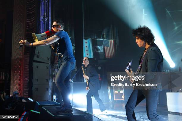 Singer Scott Weiland, bassist Robert DeLeo and guitartist Dean DeLeo of Stone Temple Pilots perform at the Riviera Theatre on March 27, 2010 in...