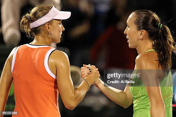 Jelena Jankovic of Serbia greets Elena Vesnina of Russia after defeating her during day six of the 2010 Sony Ericsson Open at Crandon Park Tennis...