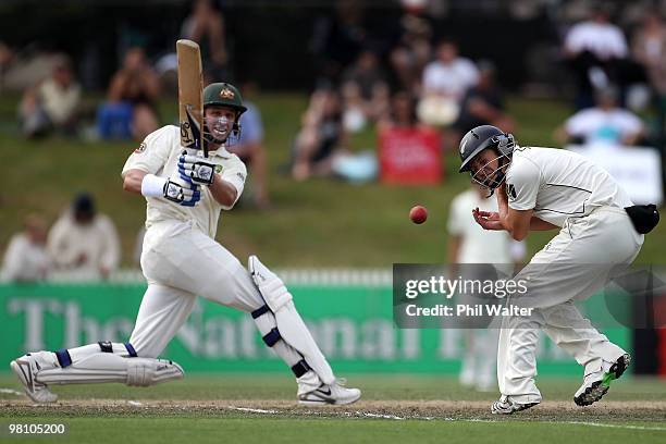 Watling of New Zealand turns away from the ball off the bat of Michael Hussey of Australia during day three of the Second Test Match between New...