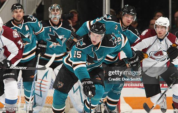 Ryan O'Reilly of the Colorado Avalanche watches as Dany Heatley, Dan Boyle and Douglas Murray of the San Jose Sharks start the rush as Thomas Greiss...