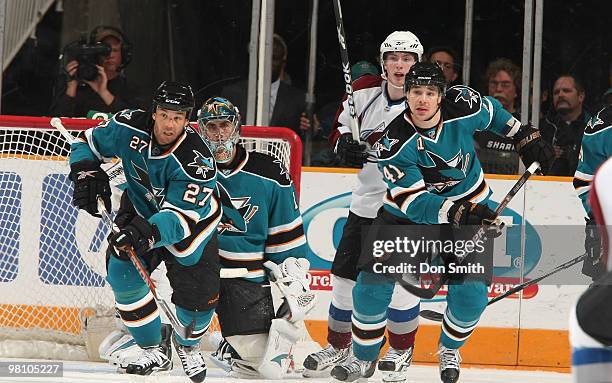 Matt Duchene of the Colorado Avalanche watches Manny Malhotra, Jed Ortmeyer and Thomas Greiss of the San Jose Sharks during an NHL game on March 28,...